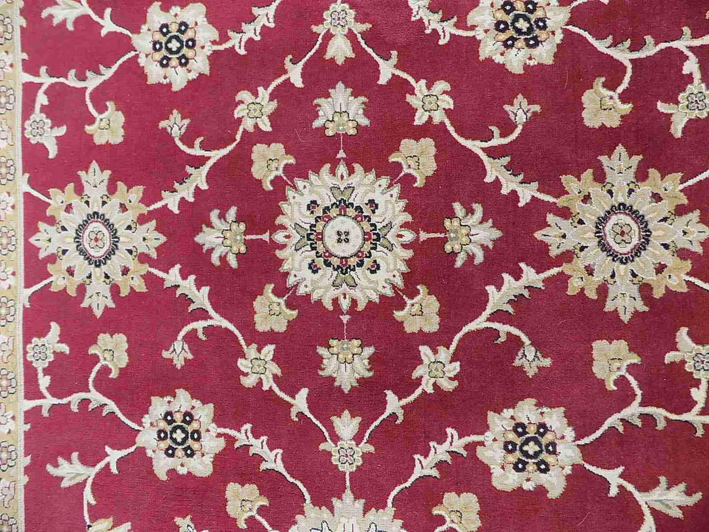 Red cream carpet with floral design