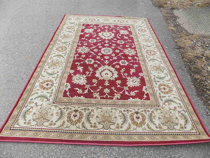 Red cream carpet with floral design