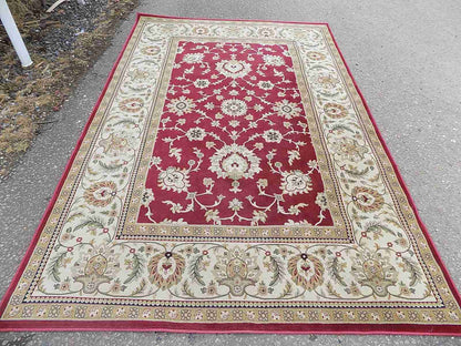 Red cream carpet with floral design