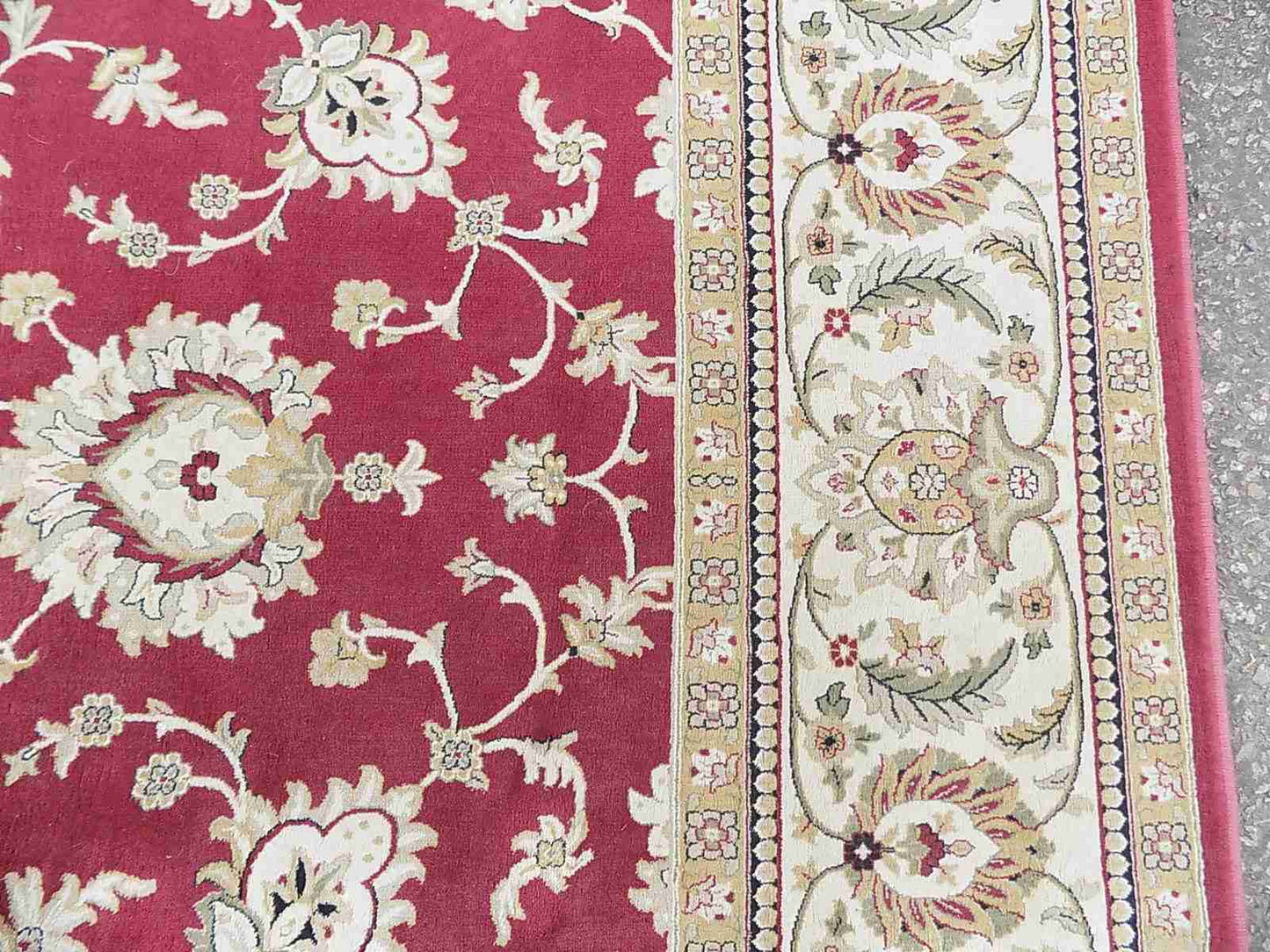 Red cream carpet with floral design